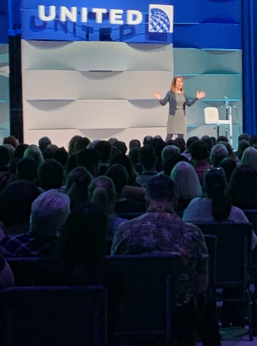 Dr. Naomi Parrella speaking to a full audience