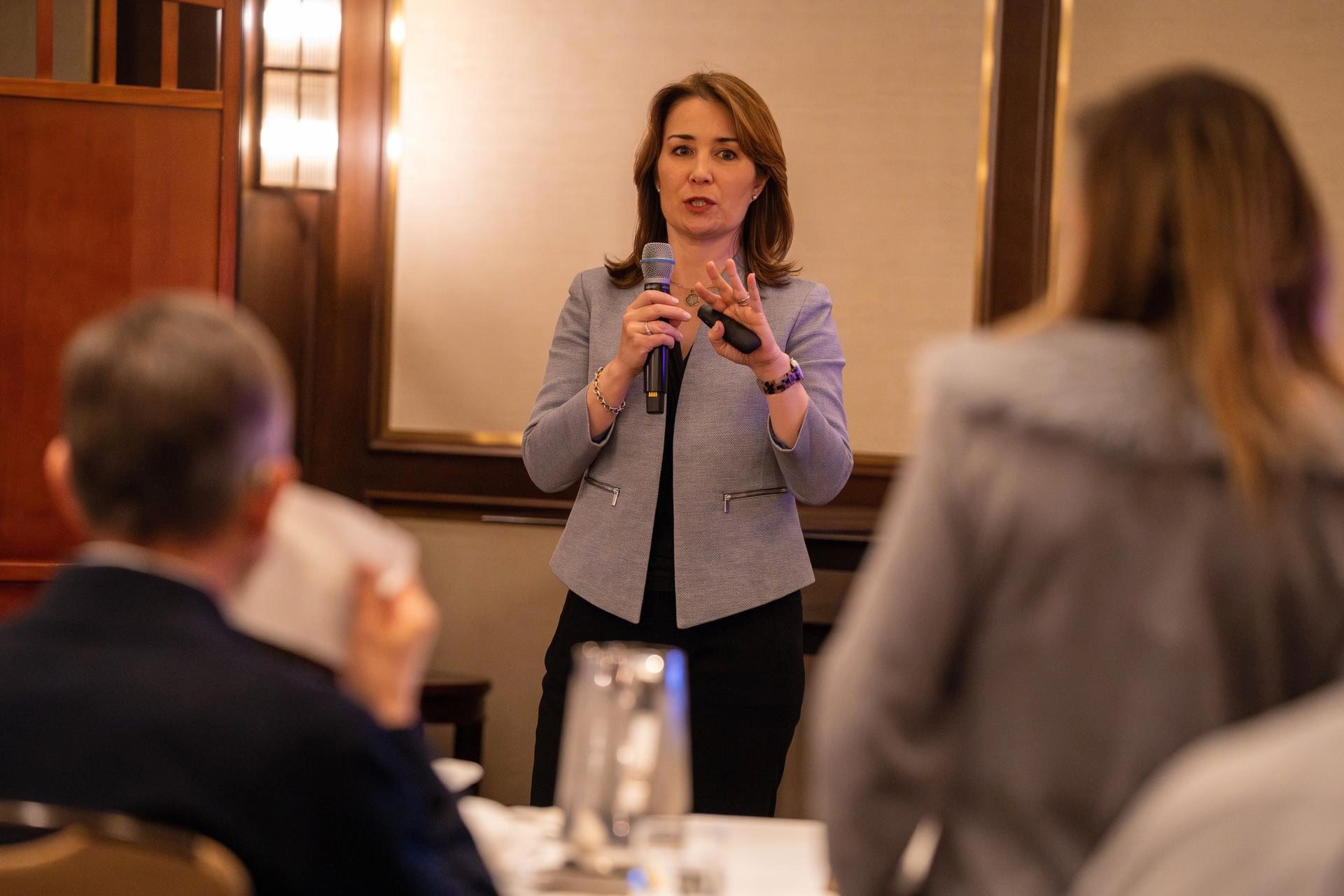 Dr. Naomi Parrella speaking to a room